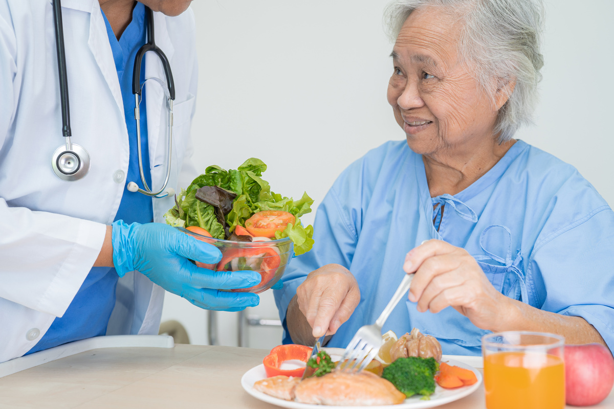 Asian Senior or Elderly Old Lady Woman Patient Eating Breakfast